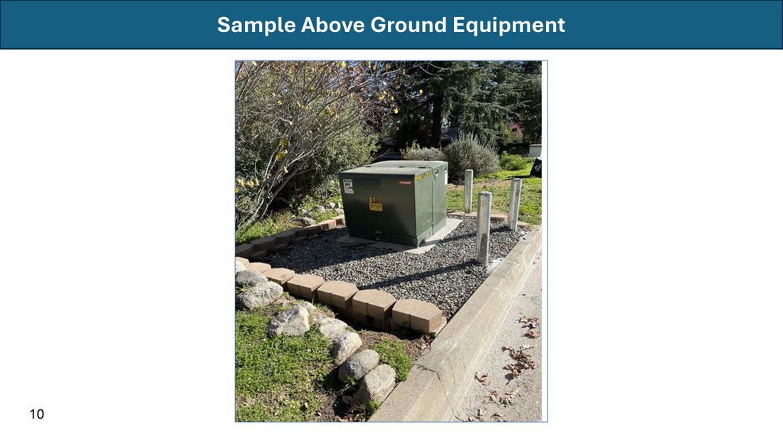 LADWP sample above-ground equipment: a green pad-mounted transformer cabinet on a gravel pad beside a sidewalk